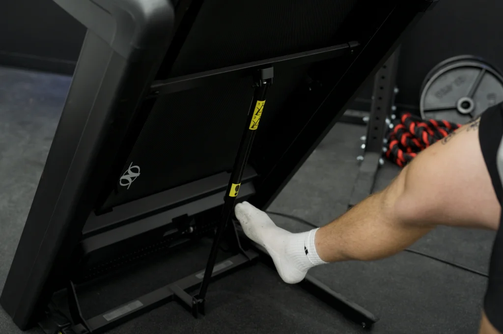Using the folding mechanism on the NordicTrack Commercial 1250 Treadmill.